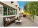 Charming patio with wooden bench and small table at 6501 E Cholla St, Scottsdale, AZ 85254