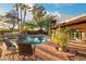 Large pool with patio seating and landscaping at 6501 E Cholla St, Scottsdale, AZ 85254