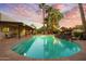 Inviting kidney shaped pool with a rock waterfall feature at 6501 E Cholla St, Scottsdale, AZ 85254