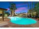 Inviting pool with waterfall feature at sunset at 6501 E Cholla St, Scottsdale, AZ 85254