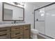 Updated bathroom with granite vanity and walk-in shower at 6842 W Holly St, Phoenix, AZ 85035