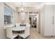 Bright kitchen with a round breakfast table and white chairs at 7637 N 6Th Ave, Phoenix, AZ 85021