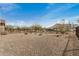 Backyard with desert landscaping and block wall fencing at 26783 W Zachary Dr, Buckeye, AZ 85396