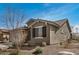 Charming single-story home with a two-car garage, stone accents, and desert landscaping at 26783 W Zachary Dr, Buckeye, AZ 85396