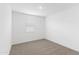 Bright bedroom featuring a neutral carpet, white walls, and a window at 36834 W La Paz St, Maricopa, AZ 85138