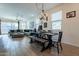 Open concept dining area with a rustic wooden table and bench at 3923 E Archer Dr, San Tan Valley, AZ 85140