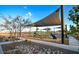 Community playground featuring shade canopies and a variety of play structures in a desert landscape at 3923 E Archer Dr, San Tan Valley, AZ 85140