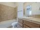 Clean bathroom featuring tiled walls, modern fixtures, and a tub-shower combination at 3948 W Salter Dr, Glendale, AZ 85308