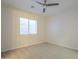 Bedroom with neutral walls, carpet, a ceiling fan, and a window at 3948 W Salter Dr, Glendale, AZ 85308