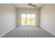 Bright bedroom with a ceiling fan and sliding glass doors to the backyard at 3948 W Salter Dr, Glendale, AZ 85308