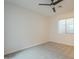 Bedroom features neutral walls, carpet, a ceiling fan, and a window at 3948 W Salter Dr, Glendale, AZ 85308