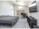 Spacious bedroom with a large bed and a dedicated workspace at 8031 N 108Th Dr, Peoria, AZ 85345