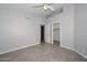 Neutral bedroom with tile flooring and walk-in closet at 8390 W Oraibi Dr, Peoria, AZ 85382