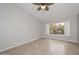 Cozy bedroom with tile flooring, window with shutters, and neutral paint at 8390 W Oraibi Dr, Peoria, AZ 85382