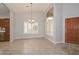 Inviting dining room with tile flooring, neutral paint, and modern lighting at 8390 W Oraibi Dr, Peoria, AZ 85382