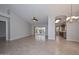 Open living area with tile flooring and sliding doors to the backyard at 8390 W Oraibi Dr, Peoria, AZ 85382