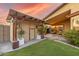 Tan colored storage shed with wooden accents in backyard at 16209 W Davis Rd, Surprise, AZ 85374