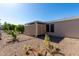 The yard features gravel, a shade structure, and drought-tolerant landscaping for easy care at 215 N Power Rd # 361, Mesa, AZ 85205