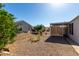 Low maintenance gravel backyard, shade structure, and drought-tolerant landscaping for easy care at 215 N Power Rd # 361, Mesa, AZ 85205
