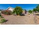 Gravel-covered backyard featuring lush trees and privacy structure, easy outdoor living and shade at 215 N Power Rd # 361, Mesa, AZ 85205