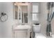 This bright bathroom features a vanity with storage, a large mirror, and a toilet at 215 N Power Rd # 361, Mesa, AZ 85205
