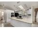 Bright kitchen with white cabinets, modern appliances, and an island; perfect for cooking at 215 N Power Rd # 361, Mesa, AZ 85205