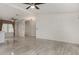 Spacious living room with tile flooring and ceiling fan fixture at 215 N Power Rd # 361, Mesa, AZ 85205