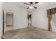 Spacious main bedroom with carpet, neutral walls, and two entry points at 215 N Power Rd # 361, Mesa, AZ 85205