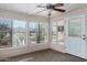 This sun room features an abundance of light and a ceiling fan at 215 N Power Rd # 361, Mesa, AZ 85205