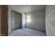 Unfinished bedroom with window, visible drywall seams, and closet ready for final touches at 2671 E Abe Truckle Ave, San Tan Valley, AZ 85140