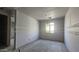 Unfinished bedroom features a window, a closet and rough drywall ready for final finishes at 2671 E Abe Truckle Ave, San Tan Valley, AZ 85140