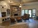 Cozy living room featuring a stone fireplace and hardwood floors at 3824 E Kachina Dr, Phoenix, AZ 85044