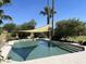 Inviting swimming pool with a shade sail and lush landscaping at 3824 E Kachina Dr, Phoenix, AZ 85044