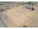 Aerial view of a new construction home on a large lot with surrounding desert landscape at 6300 N 419Th Ave, Tonopah, AZ 85354