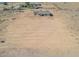 Aerial view of a newly built home with a large lot and desert surroundings at 6300 N 419Th Ave, Tonopah, AZ 85354