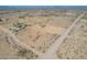 Aerial view of a house on a large lot in a rural desert area, showing roads and distant mountains at 6300 N 419Th Ave, Tonopah, AZ 85354