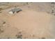 Aerial view showing a single-story house on a vacant lot in a desert setting at 6300 N 419Th Ave, Tonopah, AZ 85354