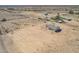 Aerial view of a new house with a large desert lot, neighboring properties visible at 6300 N 419Th Ave, Tonopah, AZ 85354