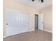 Bedroom with double door closet and access to another room at 6300 N 419Th Ave, Tonopah, AZ 85354