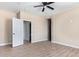 Spacious bedroom with tile flooring and access to bathroom at 6300 N 419Th Ave, Tonopah, AZ 85354