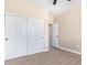 Bedroom with double door closet and access to another room at 6300 N 419Th Ave, Tonopah, AZ 85354