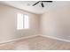 Bright bedroom with ceiling fan and neutral walls at 6300 N 419Th Ave, Tonopah, AZ 85354