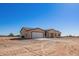 Brand new single-story home showcasing desert landscaping and a modern design at 6300 N 419Th Ave, Tonopah, AZ 85354