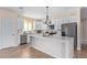 White kitchen with quartz island and stainless steel appliances at 6300 N 419Th Ave, Tonopah, AZ 85354