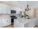 Modern kitchen with white cabinets and stainless steel appliances at 6300 N 419Th Ave, Tonopah, AZ 85354