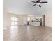 Open concept kitchen with island, white cabinets, and quartz countertops at 6300 N 419Th Ave, Tonopah, AZ 85354