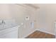 Laundry room with utility sink and shelving at 6300 N 419Th Ave, Tonopah, AZ 85354