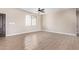 Spacious living room featuring neutral tile floors and a ceiling fan at 6300 N 419Th Ave, Tonopah, AZ 85354