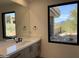 Modern bathroom featuring a large mirror and natural light that enhances the spacious feel at 10336 E Chia Way, Scottsdale, AZ 85262