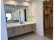 Bathroom featuring sleek floating vanity with modern finishes and minimalist style at 10336 E Chia Way, Scottsdale, AZ 85262